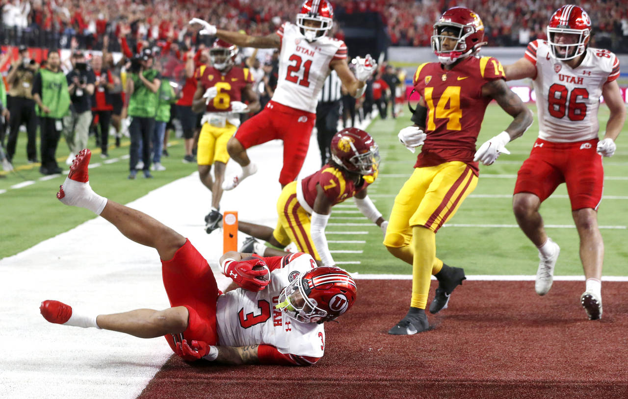 Utah running back Ja'Quinden Jackson (3) falls into the end zone for a touchdown, next to Southern ...
