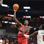 Louisville gets first win of season behind Ellis' 30 points