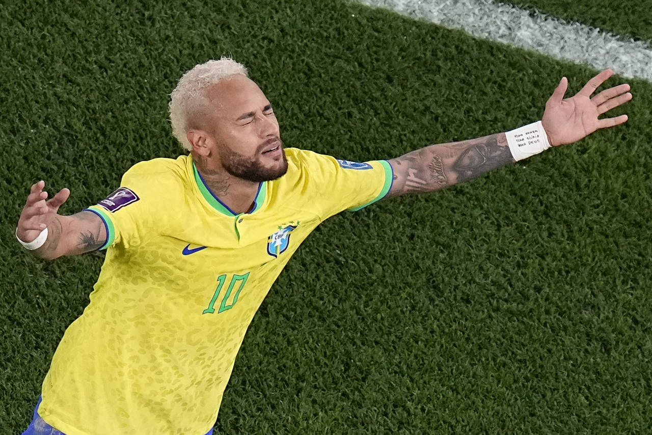 Brazil's Neymar celebrates scoring his side's second goal during the World Cup round of 16 soccer m...