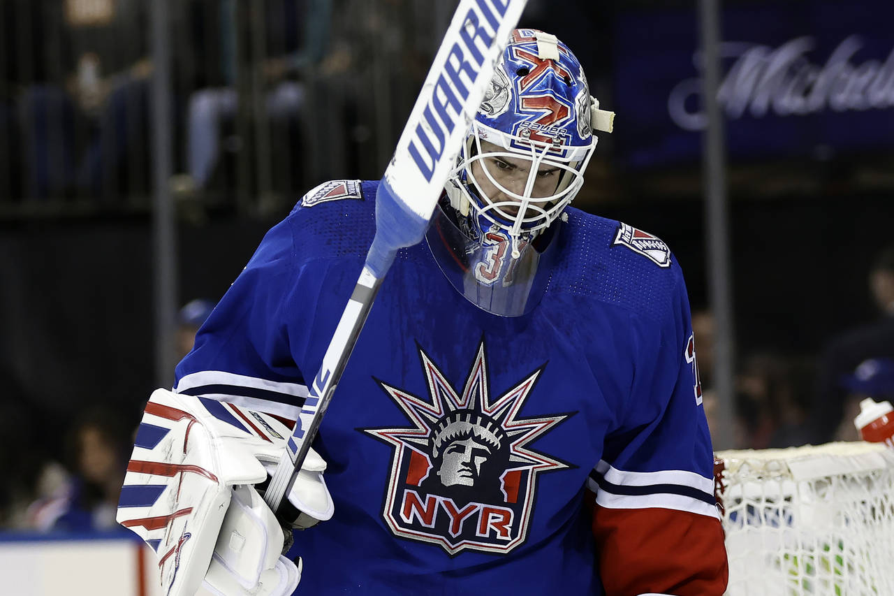 New York Rangers goaltender Igor Shesterkin reacts after giving up a goal to the Washington Capital...