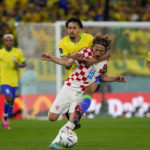 AP PHOTOS: World Cup highlights from Day 18
