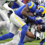 
              Seattle Seahawks linebacker Cody Barton (57) tackles Los Angeles Rams running back Cam Akers during the first half of an NFL football game Sunday, Dec. 4, 2022, in Inglewood, Calif. (AP Photo/Marcio Jose Sanchez)
            