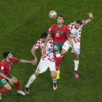 AP PHOTOS: World Cup highlights from Day 23