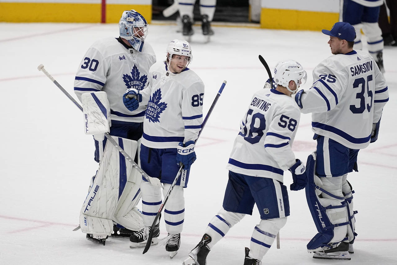 Toronto Maple Leafs' Matt Murray (30), Semyon Der-Arguchintsev (85), Michael Bunting (58) and Ilya ...