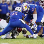 Kansas rallies, but Arkansas wins Liberty Bowl 55-53 in 3OTs