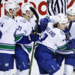 Kuzmenko scores in SO to give Canucks 4-3 win over Flames