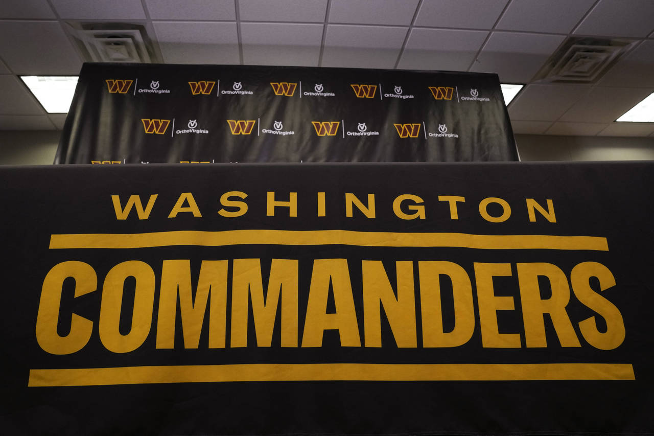 FILE - The Washington Commanders football team's name and logo is seen at the NFL football team's f...