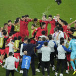 AP PHOTOS: World Cup highlights from Day 13