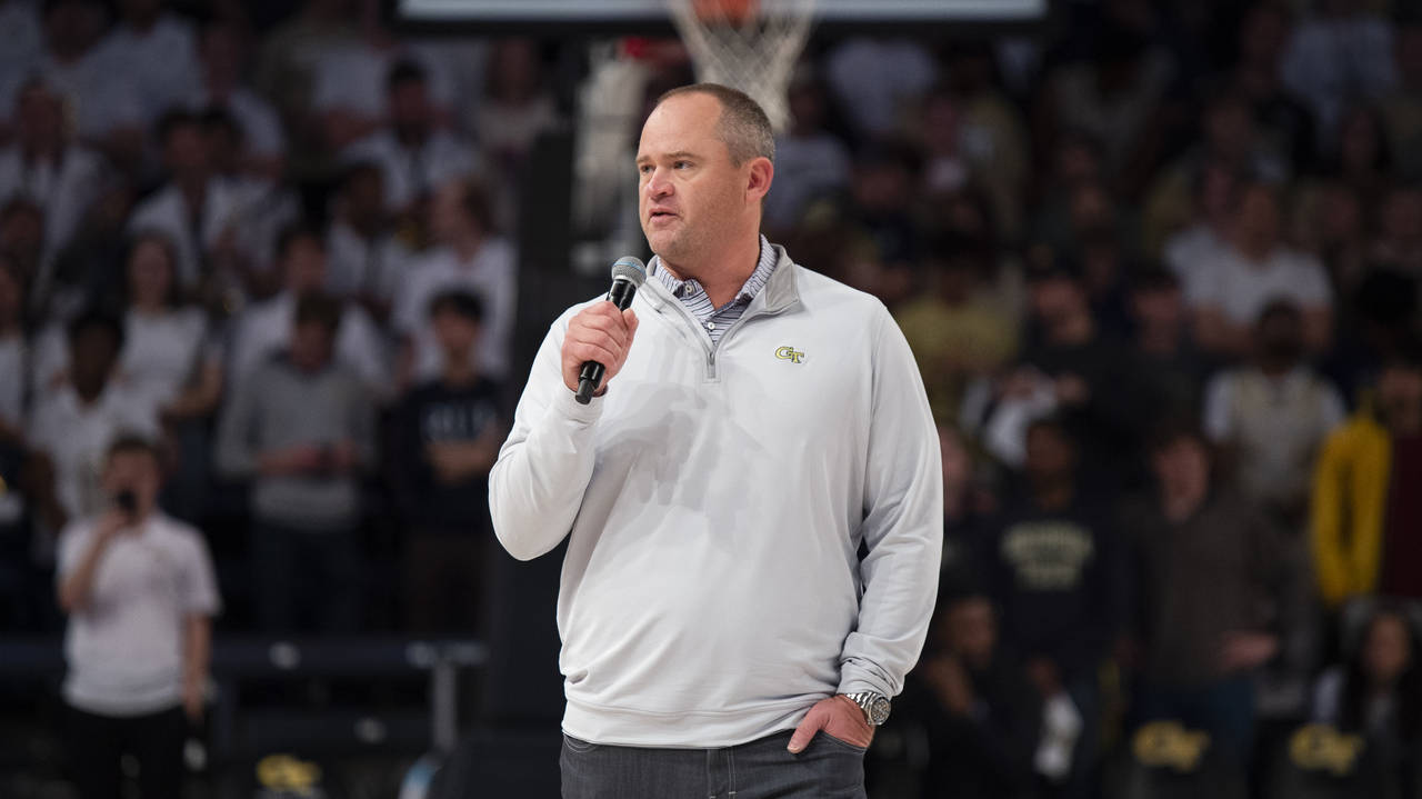 Georgia Tech football coach Brent Key speaks during halftime of an NCAA college basketball game bet...
