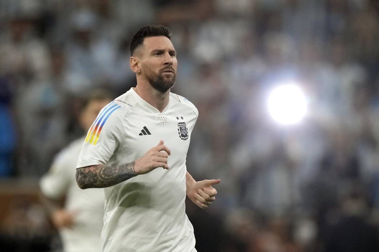 Argentina's Lionel Messi warms up for the World Cup final soccer match between Argentina and France...