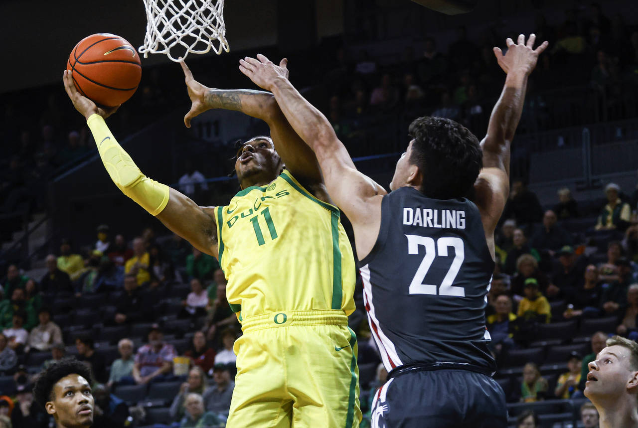 Oregon guard Rivaldo Soares (11) shoots against Washington State guard Dylan Darling (22) during th...