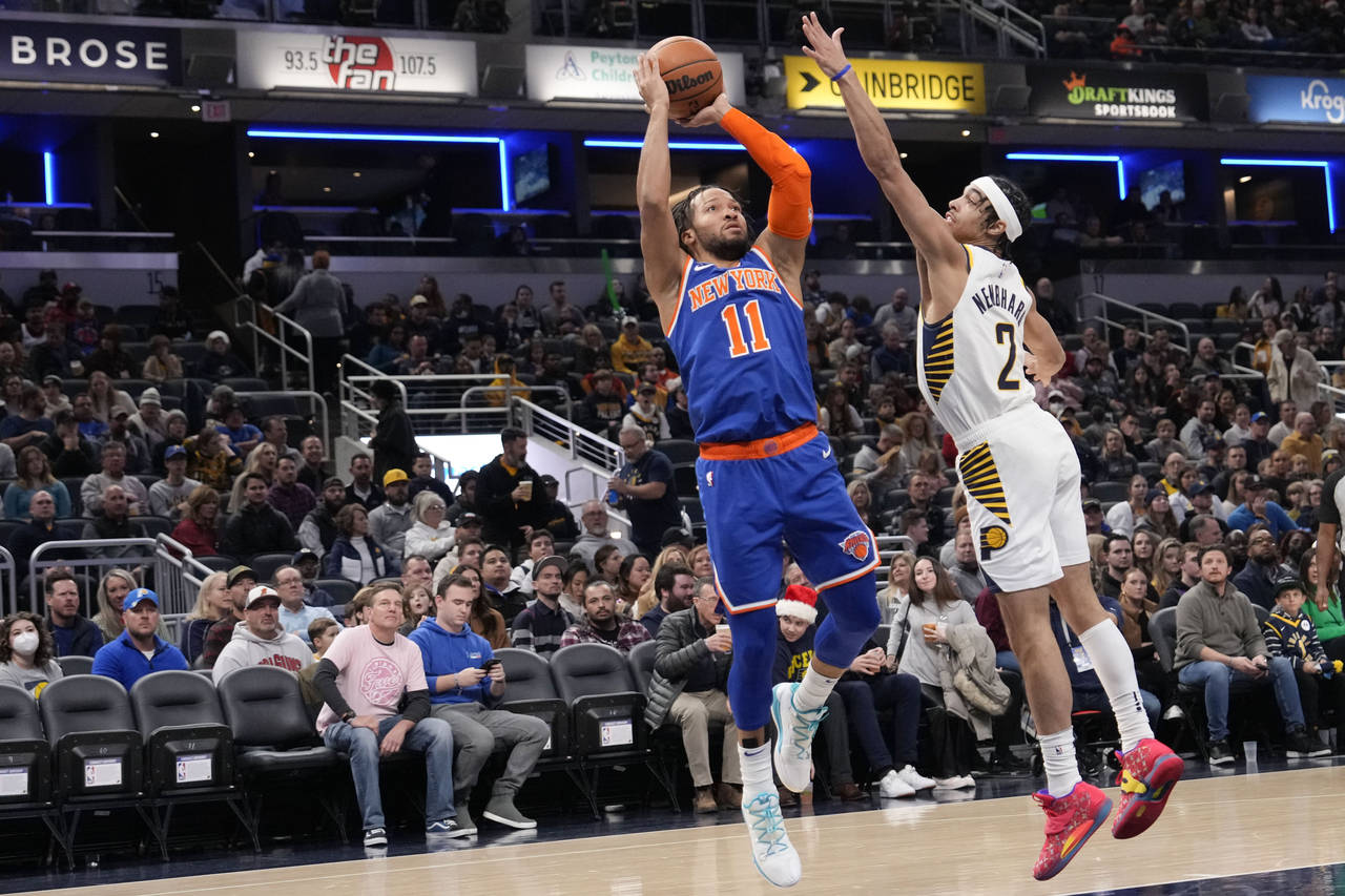 New York Knicks guard Jalen Brunson (11) shoots over Indiana Pacers guard Andrew Nembhard (2) durin...