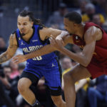 Mitchell scores 34, Cavaliers top Magic 107-96