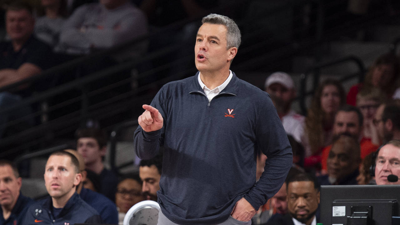 Virginia head coach Tony Bennett points to an official in the second half of an NCAA college basket...