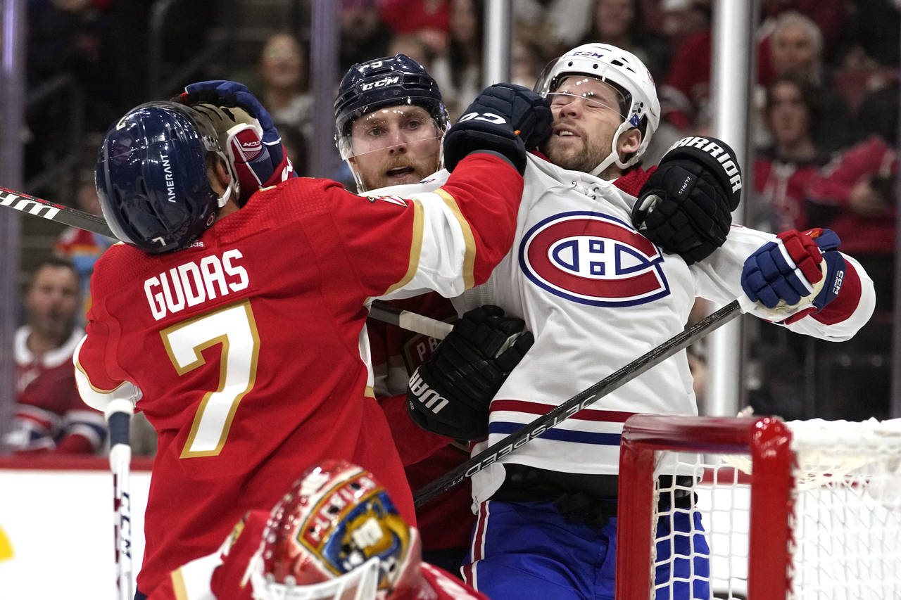 Florida Panthers defenseman Radko Gudas (7) grabs Montreal Canadiens right wing Josh Anderson, righ...