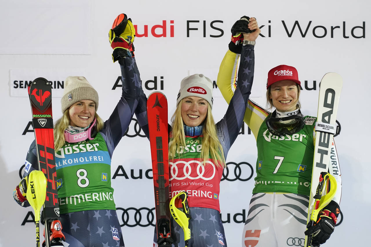 United States' Mikaela Shiffrin, center, winner of an alpine ski, World Cup women's slalom, celebra...