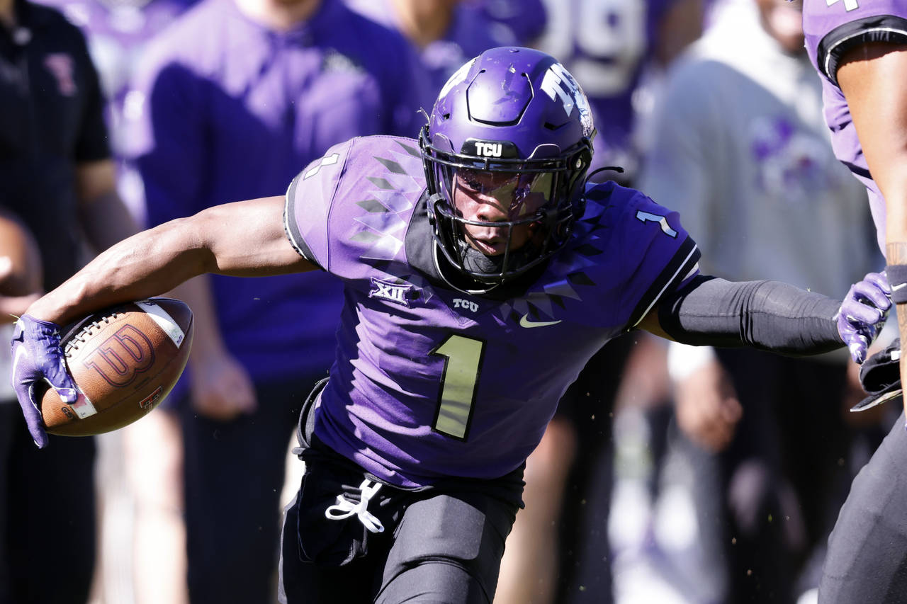 FILE - TCU cornerback Tre'Vius Hodges-Tomlinson (1) returns an interception against Texas Tech duri...