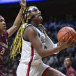 No. 9 UConn wins without Auriemma, topping Florida St 85-77