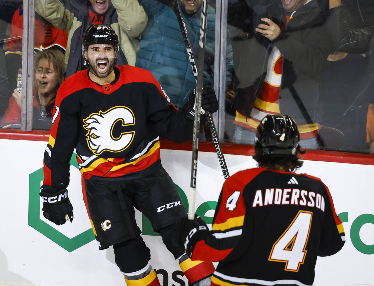 Calgary Flames forward Nazem Kadri, left, celebrates his goal with teammate Rasmus Andersson during...