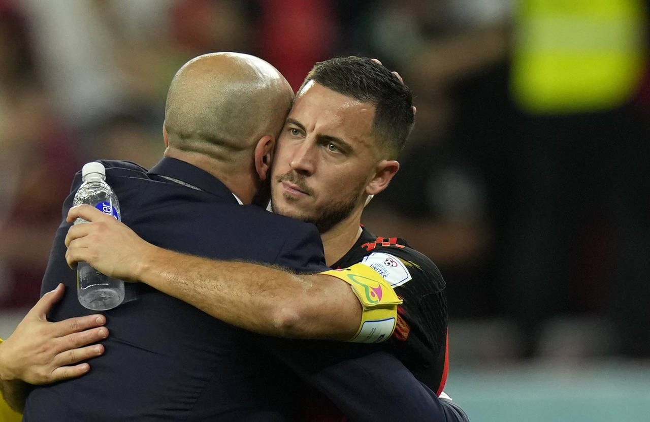 Belgium's head coach Roberto Martinez, left, hugs Belgium's Eden Hazard after the World Cup group F...