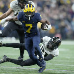 No. 2 Michigan beats Purdue 43-22 for Big Ten crown