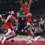 Fox has 27 points and 10 assists, Kings beat Raptors 124-123