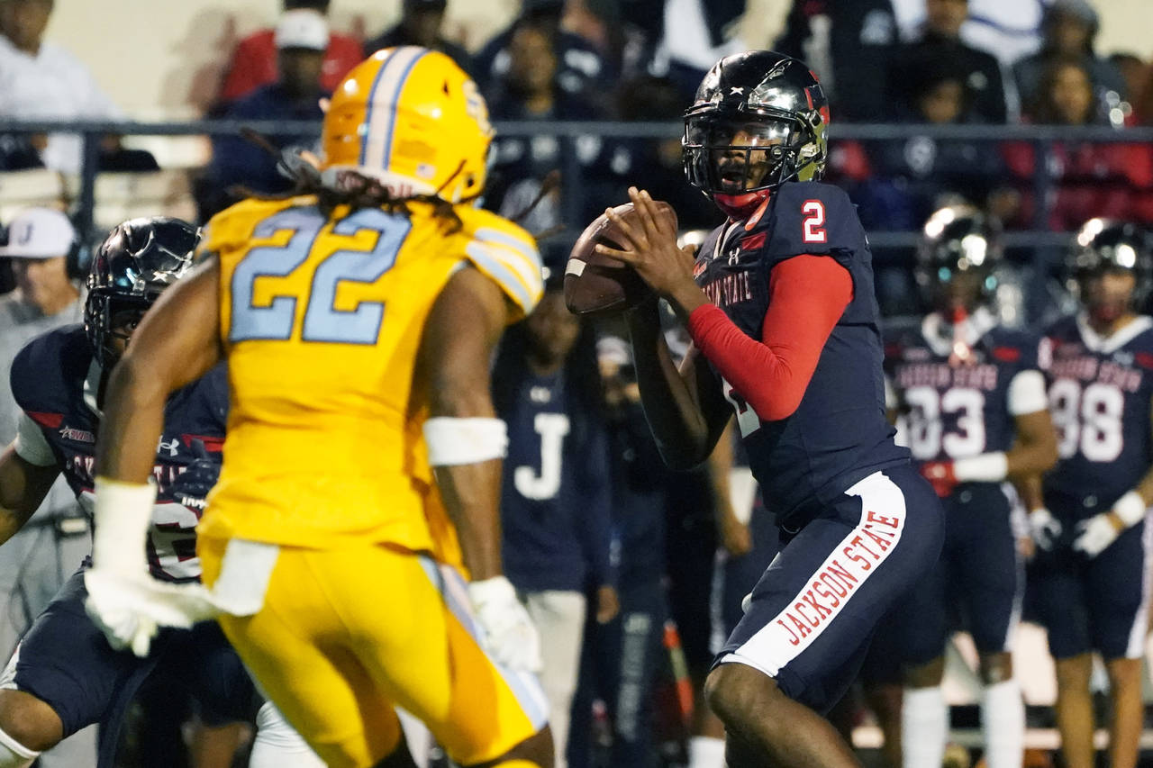 Jackson State quarterback Shedeur Sanders (2) is pressured by Southern defensive back Glenn Brown (...