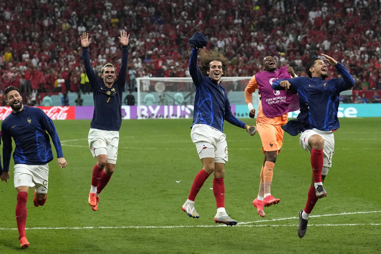 France's Antoine Griezmann celebrates with team mates after the World Cup semifinal soccer match be...