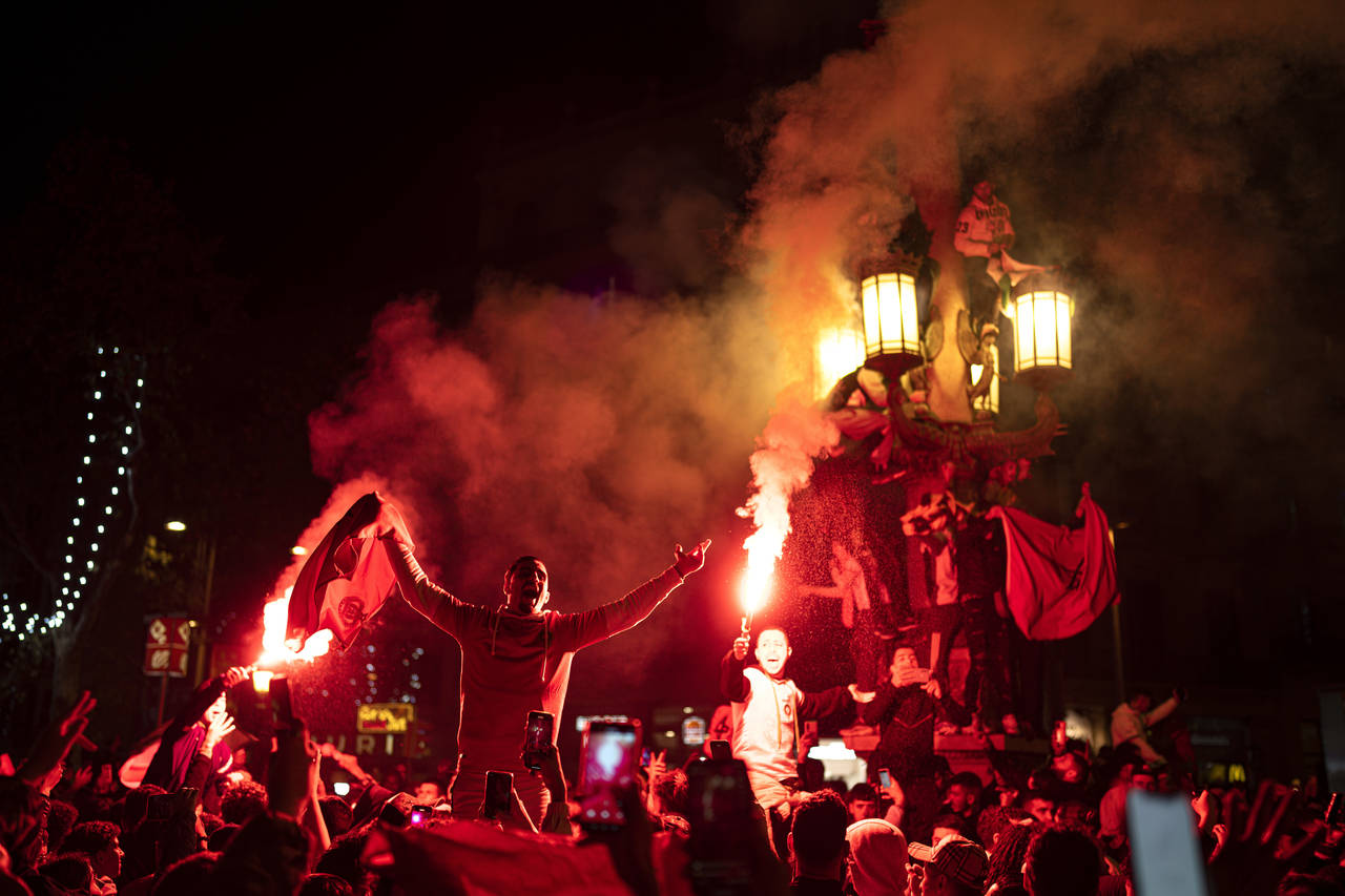 FILE - Morocco fans celebrate in Barcelona, Spain, Tuesday, Dec. 6, 2022. Morocco beat Spain on pen...