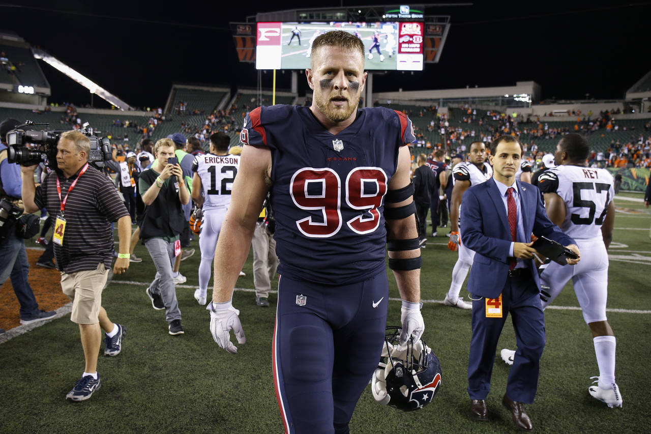 FILE - Houston Texans defensive end J.J. Watt (99) walks off the field after the team's 13-9 win ov...