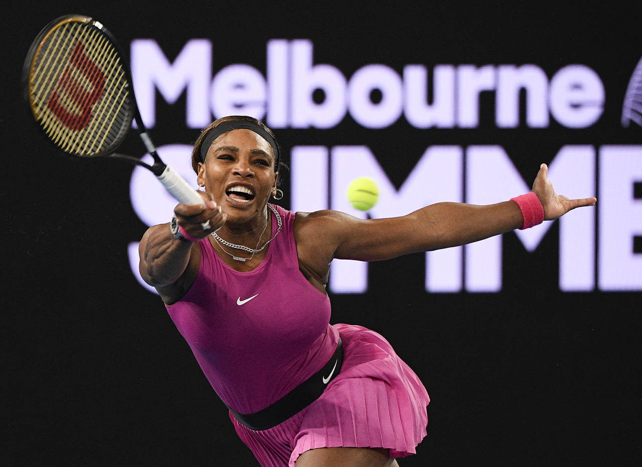 FILE - United States' Serena Williams makes a forehand return to compatriot Danielle Collins during...