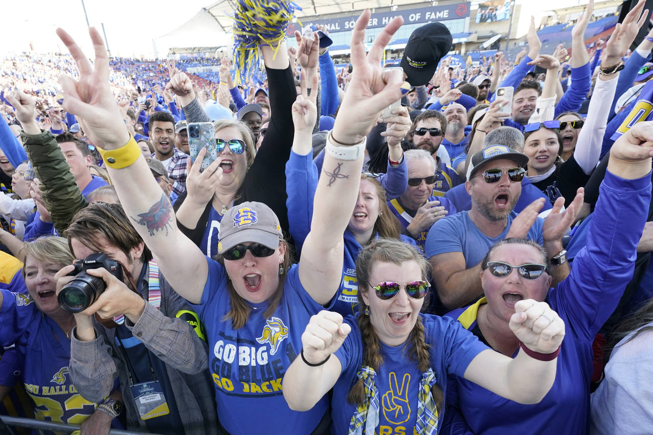 CORRECTS TO NORTH DAKOTA STATE NOT NORTH DAKOTA - South Dakota State fans celebrate on the filed af...