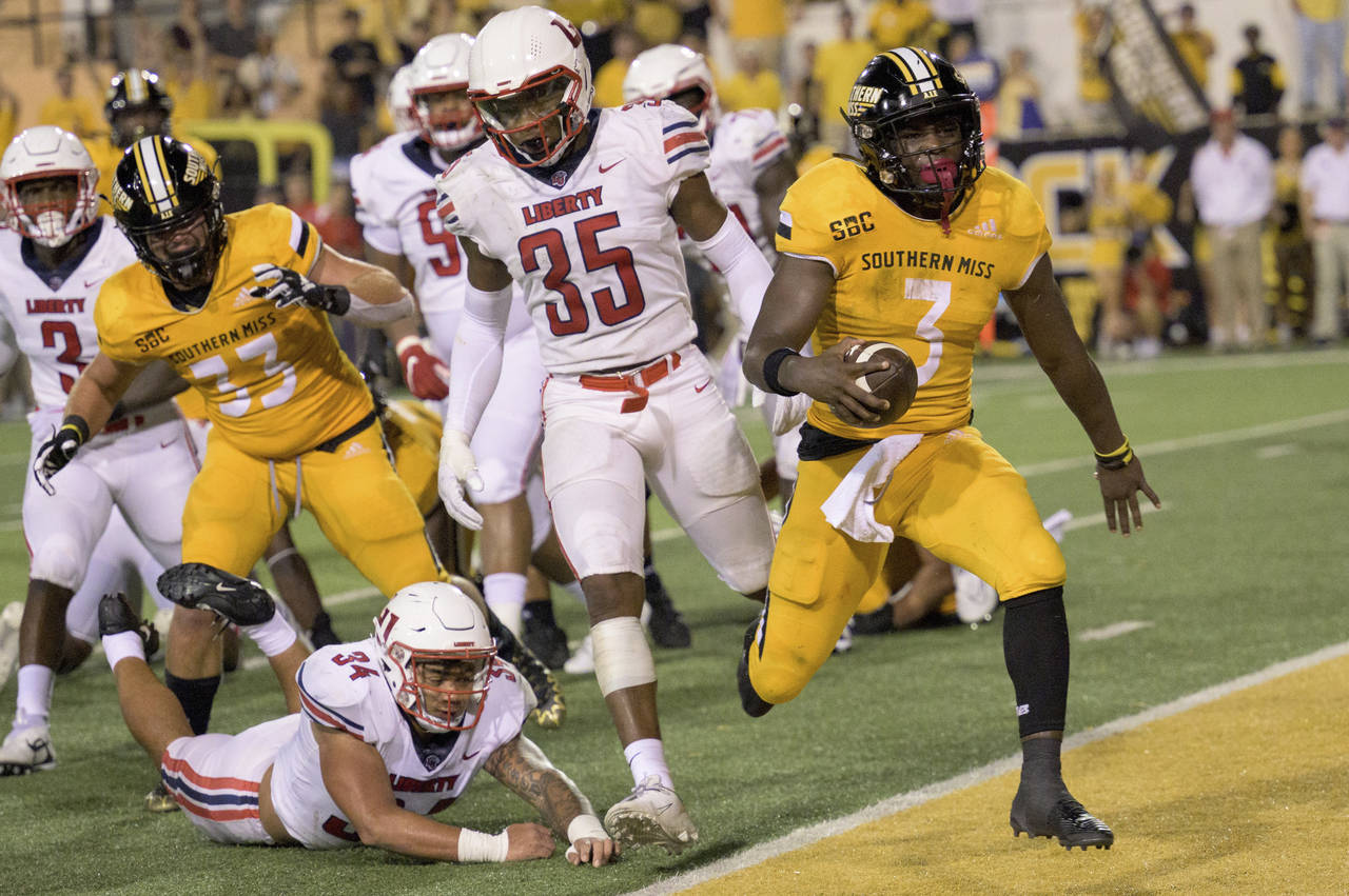 FILE - Southern Miss running back Frank Gore Jr. (3) scores while filling in as quarterback against...