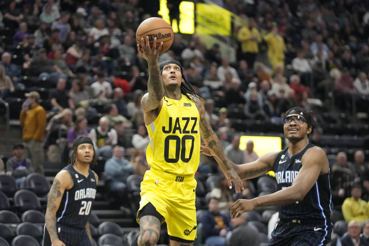 Utah Jazz guard Jordan Clarkson (00) goes to the basket as Orlando Magic center Wendell Carter Jr.,...