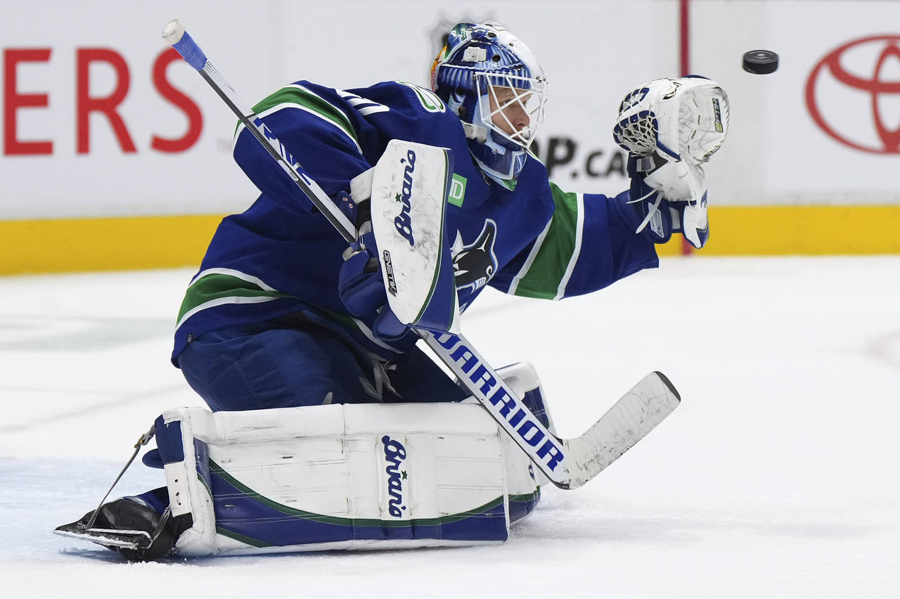 Vancouver Canucks goalie Collin Delia allows a goal to Colorado Avalanche's Samuel Girard during th...