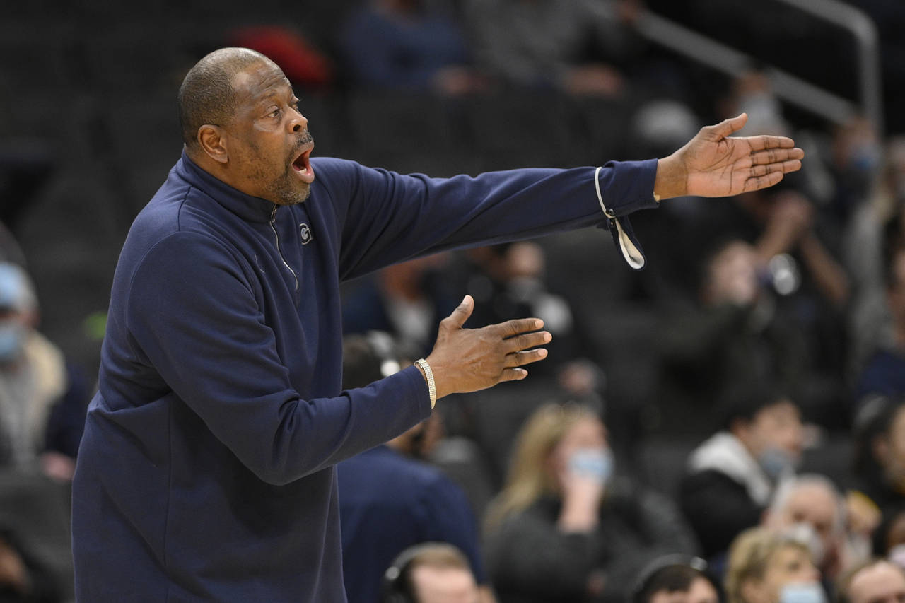 FILE - Georgetown head coach Patrick Ewing reacts during the first half of an NCAA college basketba...