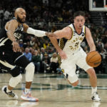 Holiday sparks late rally as Bucks beat Pacers 132-119
