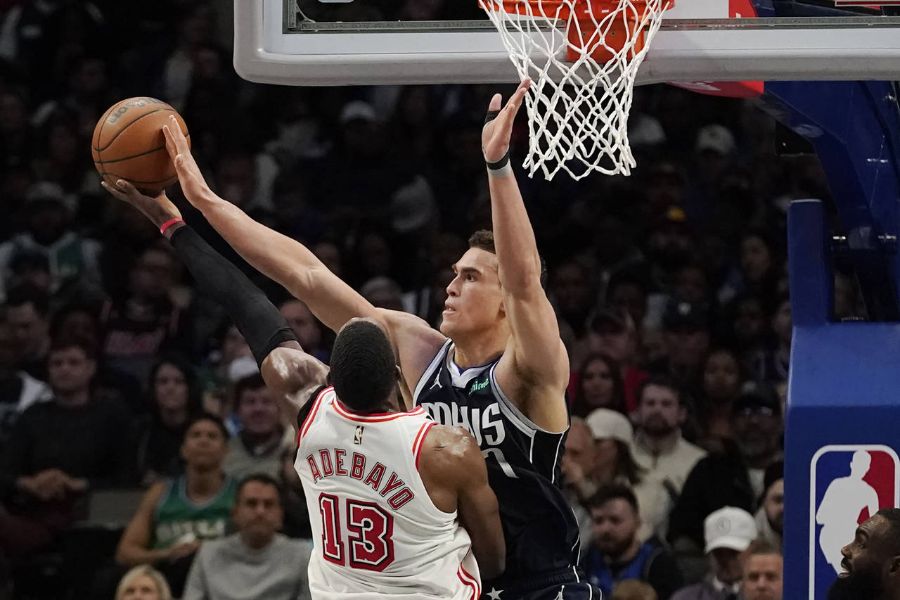 Miami Heat center Bam Adebayo (13) shoots against Dallas Mavericks center Dwight Powell (7) during ...