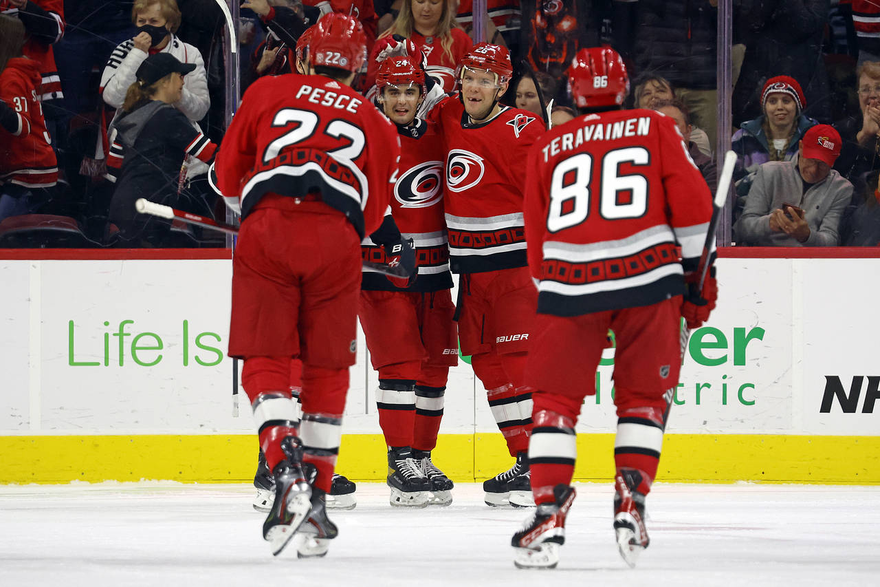 Carolina Hurricanes' Paul Stastny, second from right, celebrates after his goal with teammates Seth...
