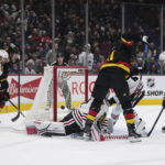 Canucks beat Blackhawks 5-2 in Tocchet's debut as coach