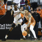 Carr, tough defense lead No. 6 Texas past Oklahoma St. 56-46