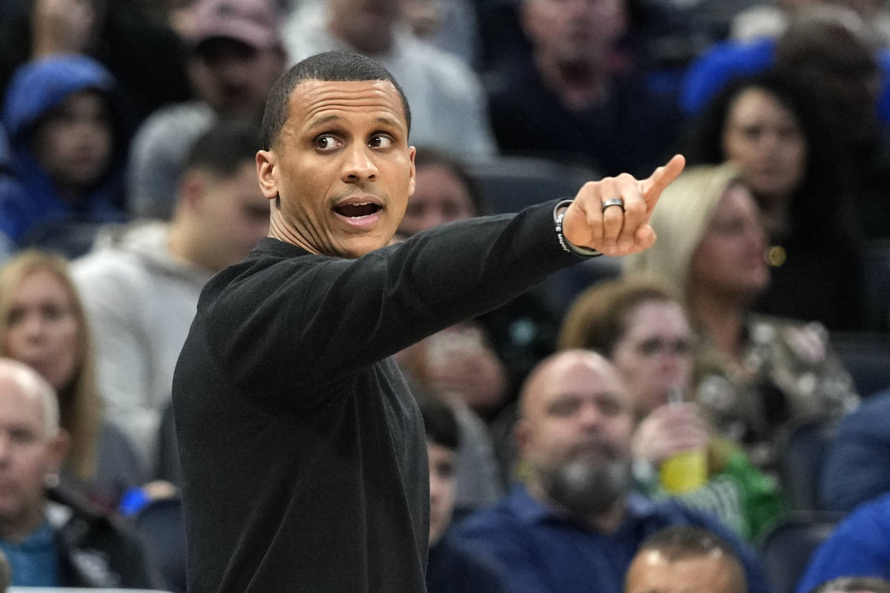 Boston Celtics head coach Joe Mazzulla directs his players on the court during the first half of an...