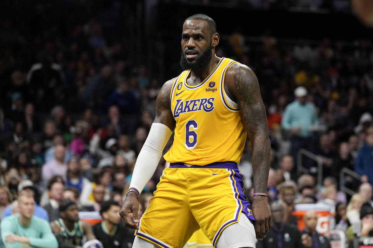 Los Angeles Lakers forward LeBron James celebrates after scoring during the first half of an NBA ba...