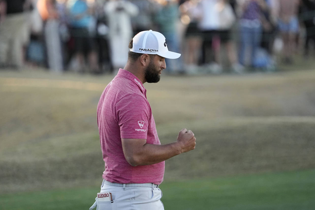 Jon Rahm pumps his fist after winning the American Express golf tournament on the Pete Dye Stadium ...
