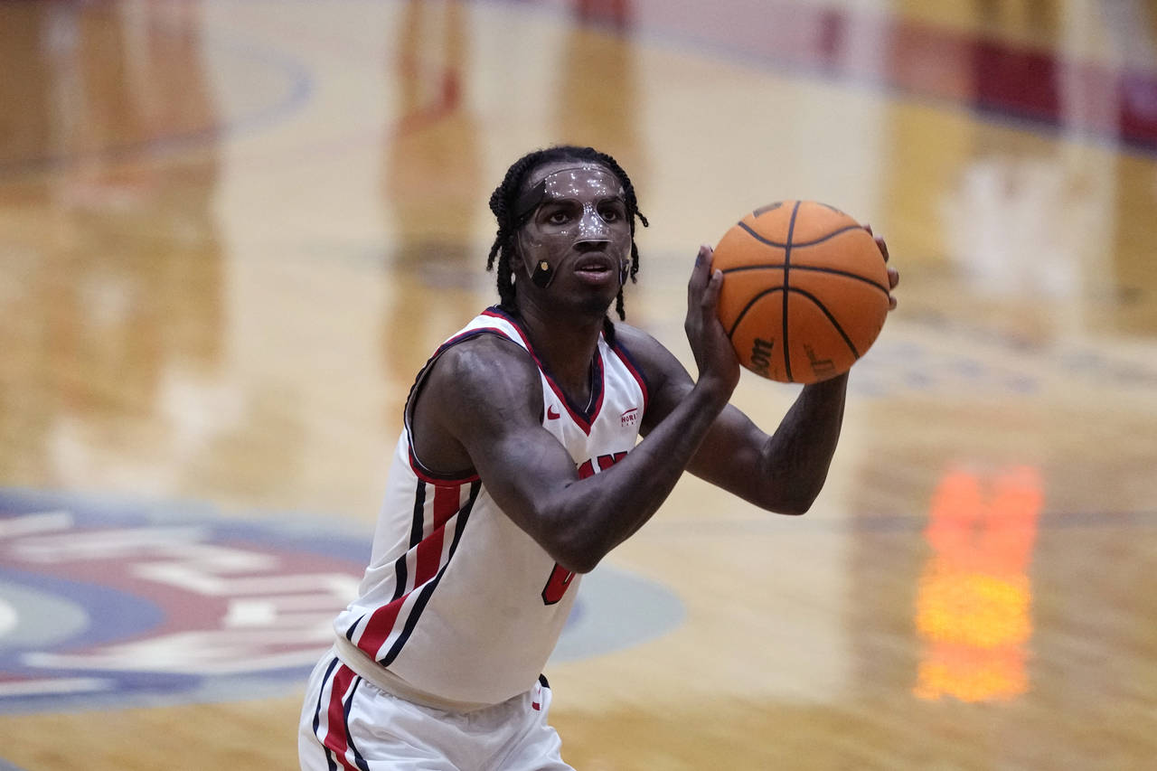 Detroit Mercy guard Antoine Davis shoots a free-throw during an NCAA college basketball game agains...