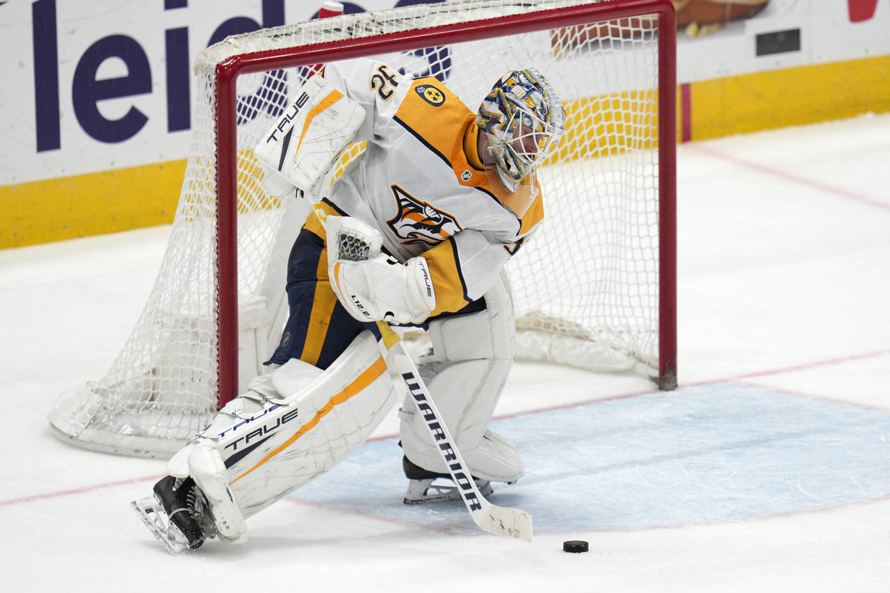 Nashville Predators goaltender Kevin Lankinen moves the puck during the third period of the team's ...