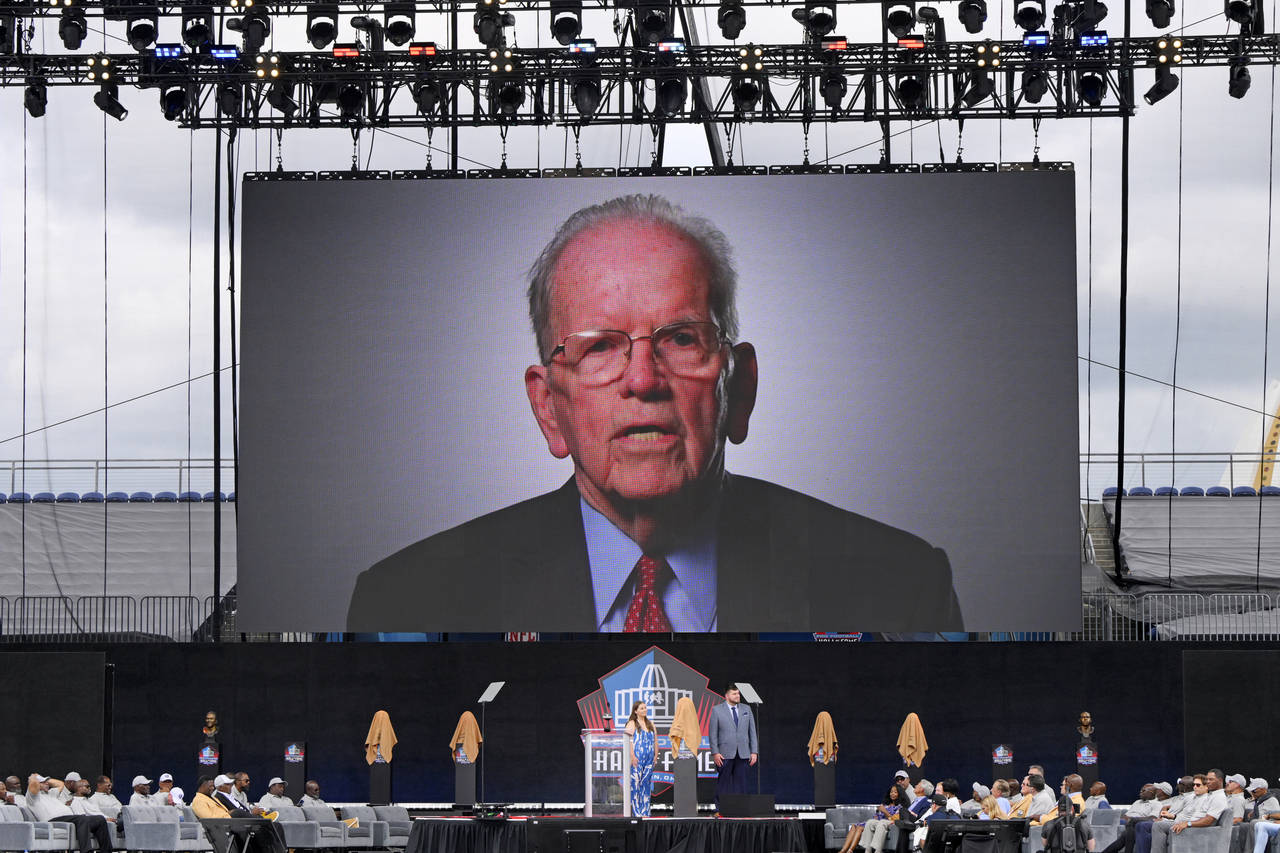 FILE - A video of NFL official Art McNally is played during an induction ceremony at the Pro Footba...