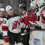 Hughes, Bratt lead Devils' 6-2 rout of Ducks