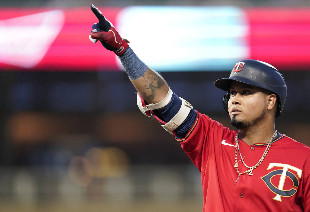FILE - Minnesota Twins' Luis Arraez points to the dugout after hitting a single against the Kansas ...