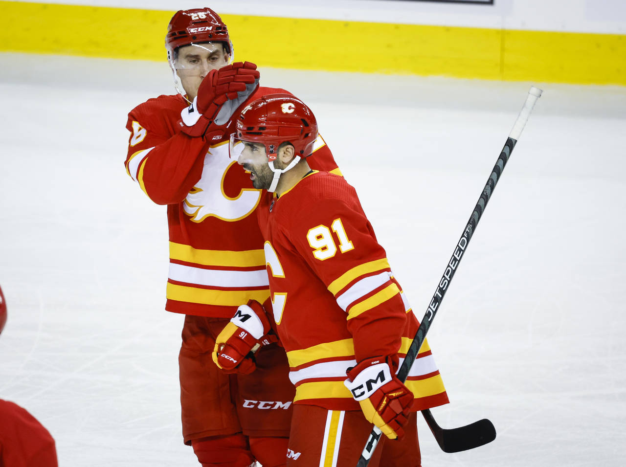 Calgary Flames forward Nazem Kadri, right, celebrates his goal against the New York Islanders with ...